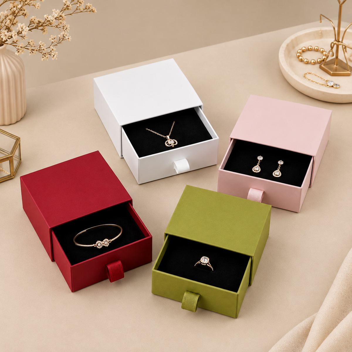 White pink red and grass green drawer jewelry boxes displaying jewelry; jewelry is not included