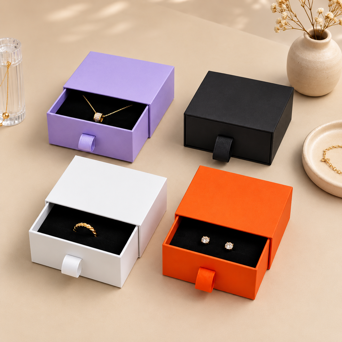Open paper drawer jewelry boxes with black inserts and ribbon pulls